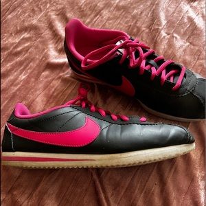 Pink and black Nike Cortez